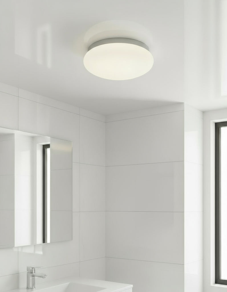 Sensor Ceiling light fixture with white shade and gray rim on a white background