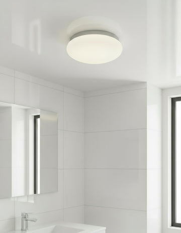Sensor Ceiling light fixture with white shade and gray rim on a white background